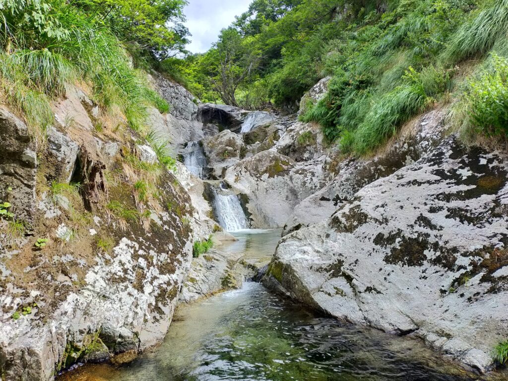 Three-tiered waterfall with pools white water Nanatakisawa upper section Japan