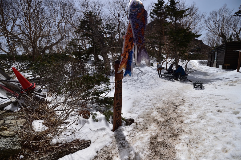 View during descent from Hōō Sanzan showing surrounding Southern Alps peaks under clear sky