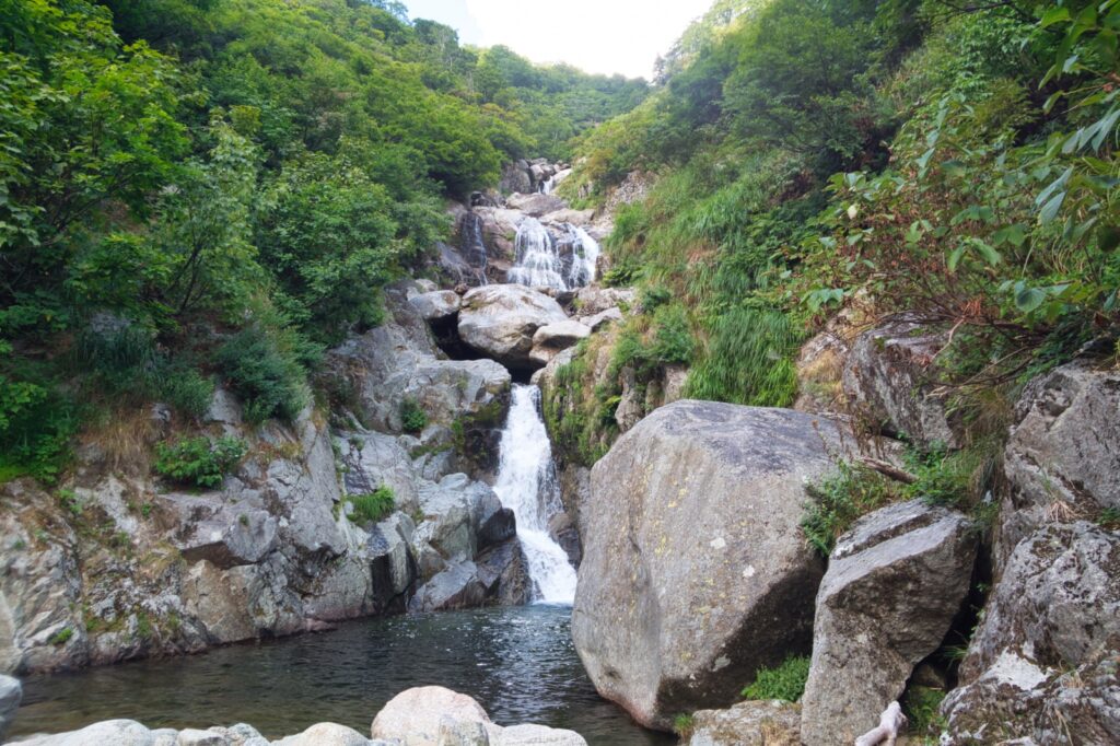 Seven-tiered 130-meter waterfall cascade in Nanatakisawa, Iide Range Japan