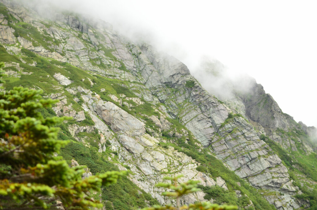 White granite Buttress wall on Mt. Kitadake with climbers, Southern Japan Alps