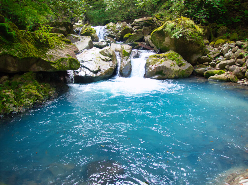 Sukkan-zawa gorge columnar basalt emerald water Japan