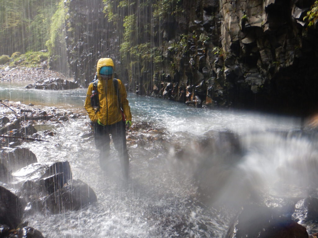 Sukkan-zawa curtain waterfall climbers in rain gear sawanobori Japan