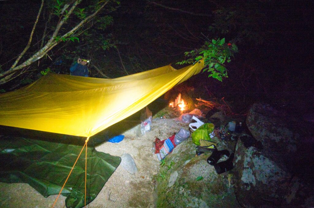 Bivouac campsite sandy riverbank Nanatakisawa stream 824m elevation Japan