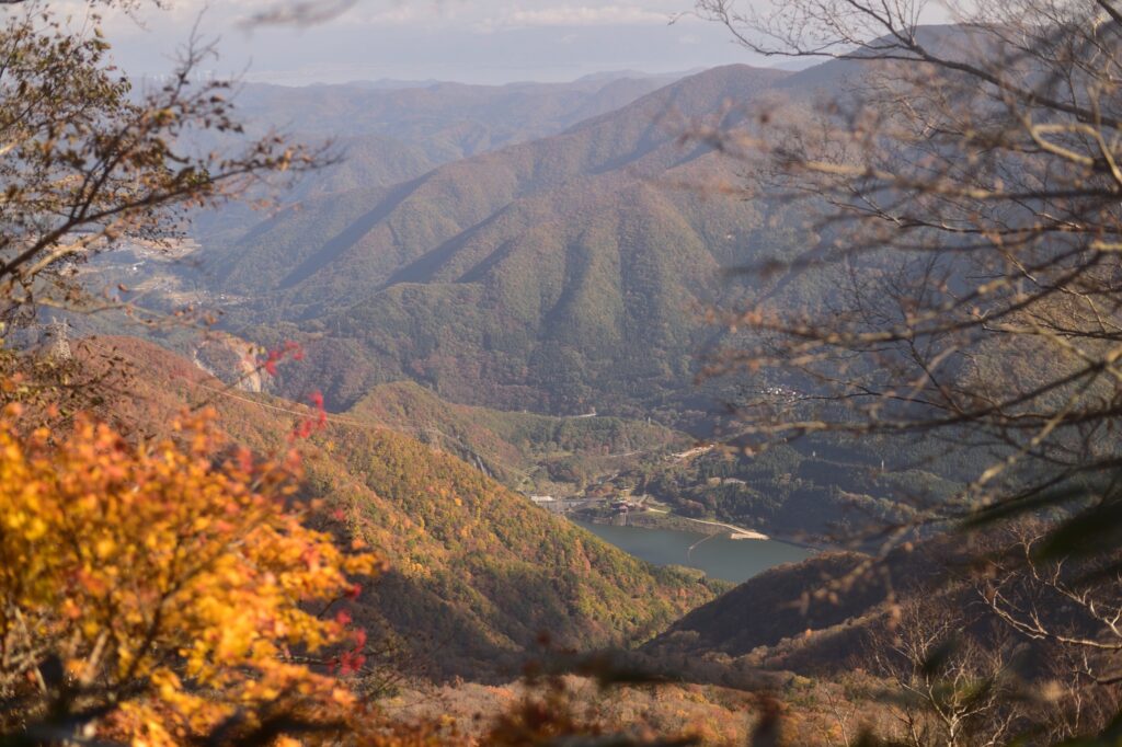 Lake Okawa Dam view from Mt. Onodake summit with autumn-colored mountains, Aizu region panorama