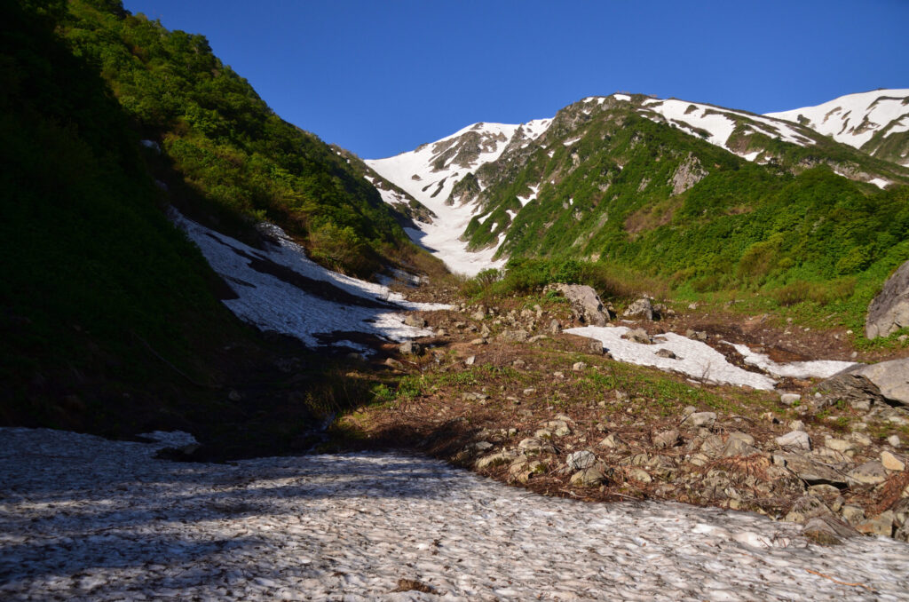 Mid-section of Ishikorobi snowfield ascent with stable snow conditions