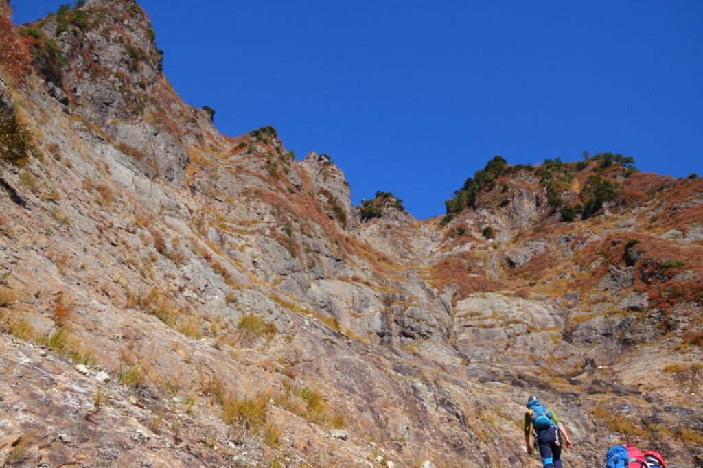 Climber ascending open granite slab Mt. Maegadake South Wall Japan alpine climbing