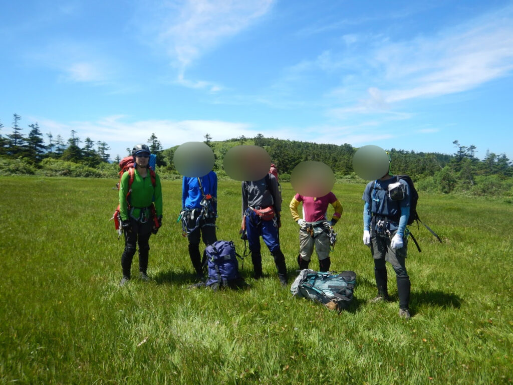Topping out at Oshiromori wetlands after Kitanomata-zawa stream climbing ascent, Hachimantai highland marsh Japan