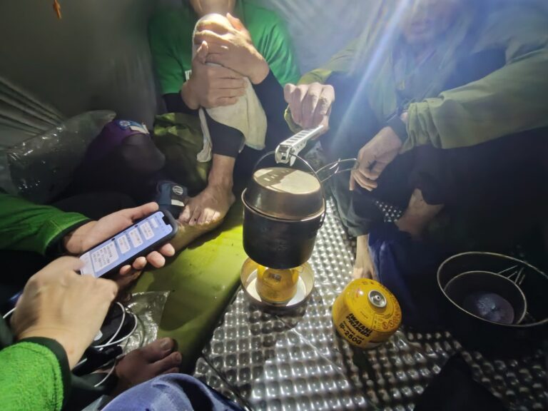 Emergency bivouac four climbers two-person tent Iide Mountains Japan night