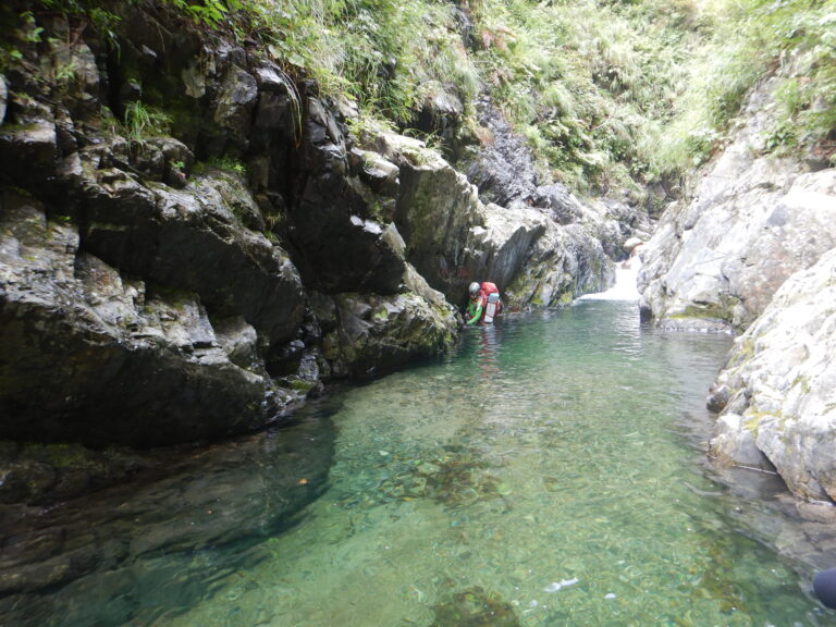 Stream climber ascending small waterfall granite wall Naranokisawa Japan sawanobori