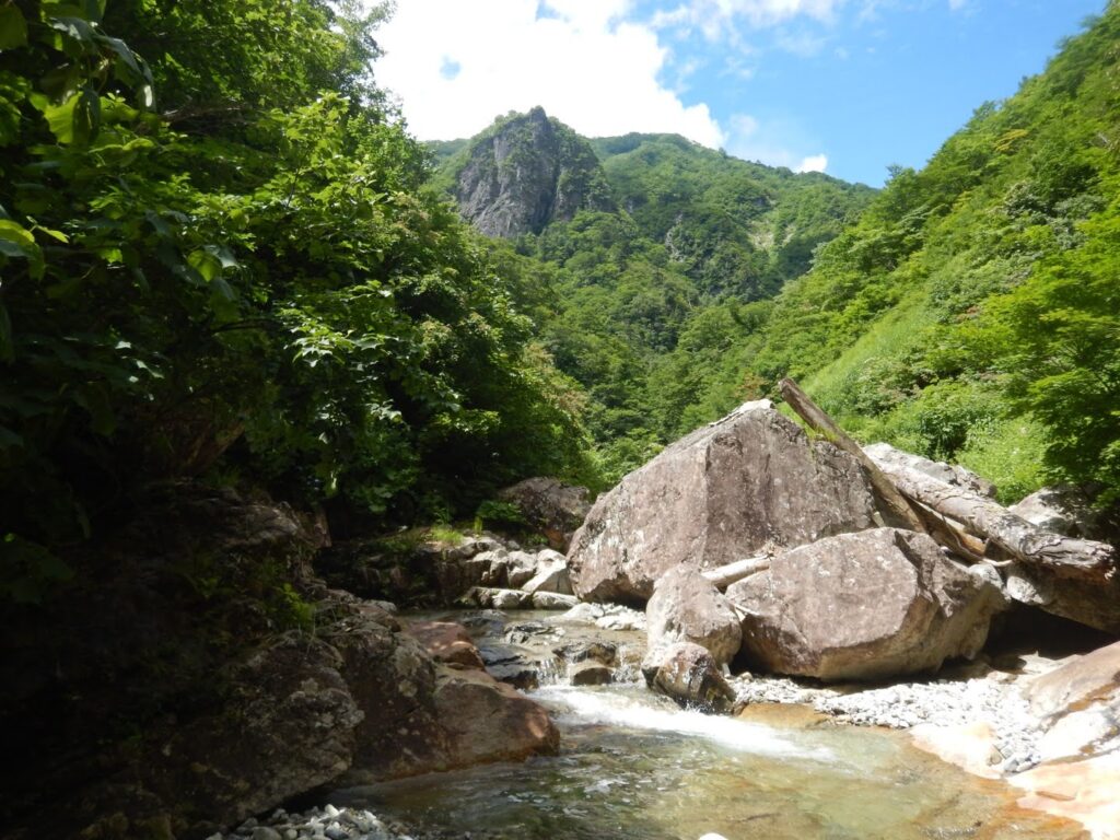 Canyon opening with Kurogane-ganpo rock tower, Sasaana-zawa, Tanigawa Range Japan